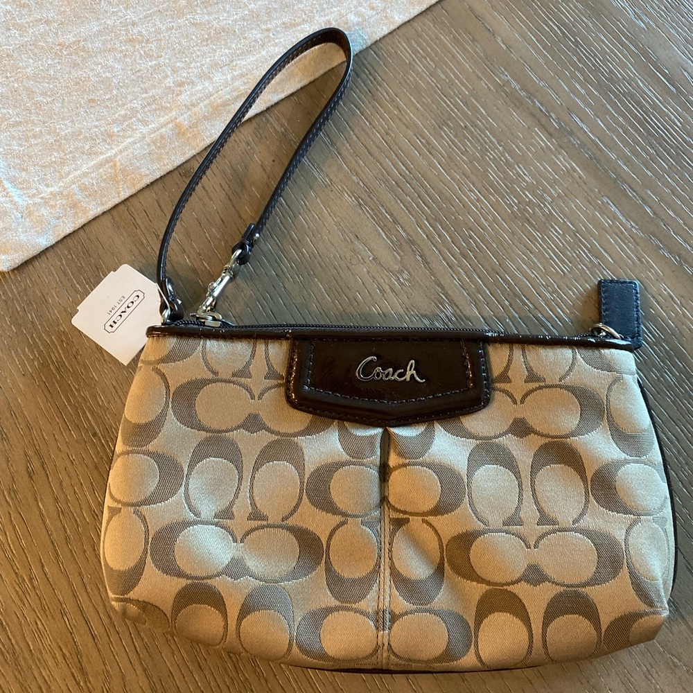 New with tags coach wristlet.  Never used.